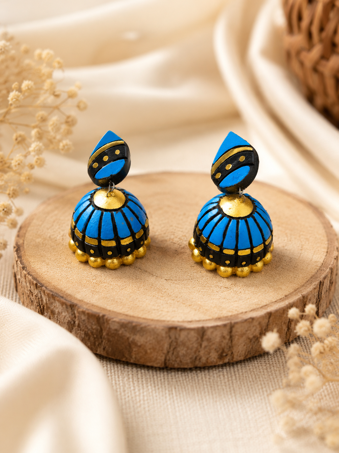 Pair of Azure Dome handmade terracotta jhumki earrings featuring hand-painted traditional clay dome designs in rich azure blue and metallic accents