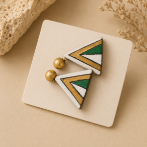 Handcrafted forest green terracotta jewellery set featuring bold arrow-inspired tribal motifs with matching necklace and earrings