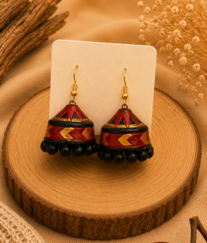 Rustic Heritage handmade terracotta hanging jhumka earrings displaying a hand-painted antique tiered clay design in traditional brick red, brown, and gold.
